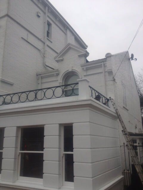 Large built in balcony on a white building