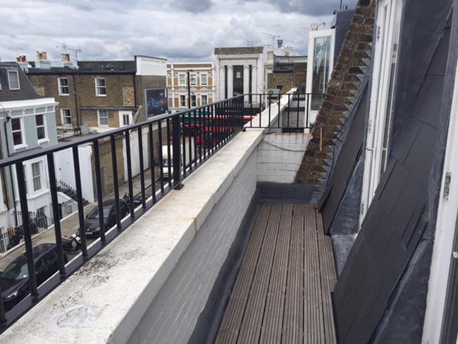 Short black fencing around a building edge