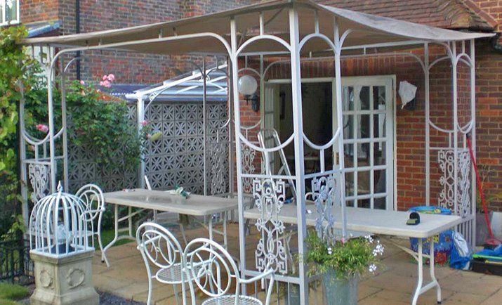 White metal canopy in residential garden