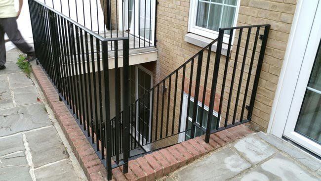 Vertical striped black metal fencing and railings