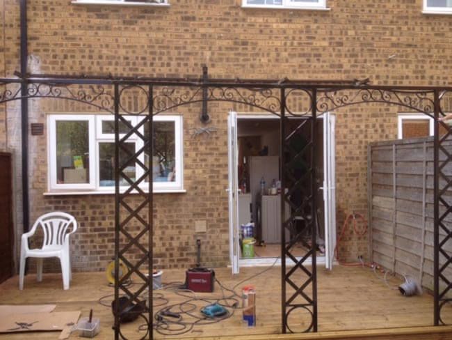 Black metal railings around outside decking