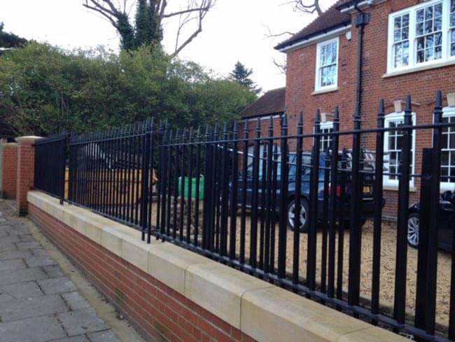 Straight black railings outside property