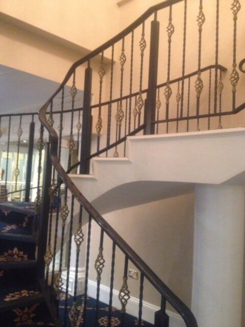 Curved metal staircase with detailing