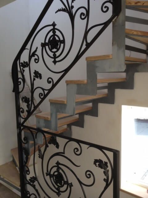 Simple black handrails with minimal detailing