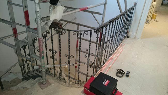 Twisted handrail being constructed