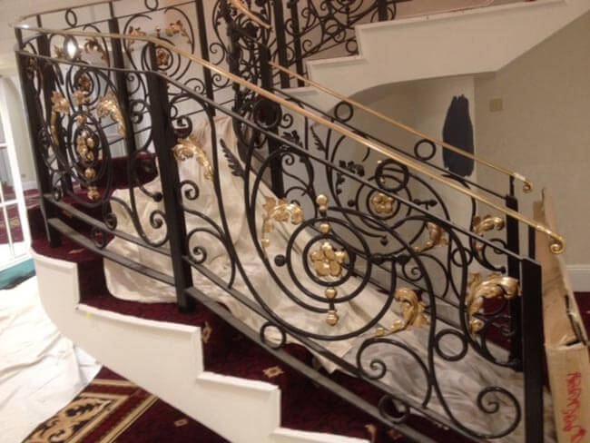 Grand gold and black curved staircase