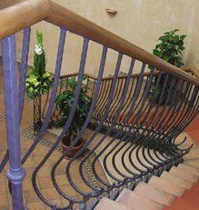 Staircase with wooden and metal handrail and balustrades