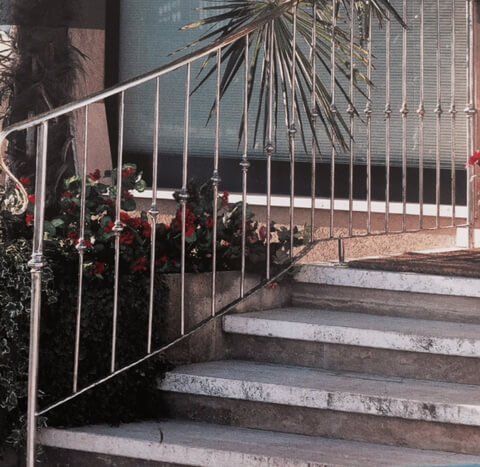Silver metal railings on outdoor stairs