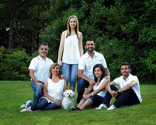 Photo of a family all wearing a white shirt