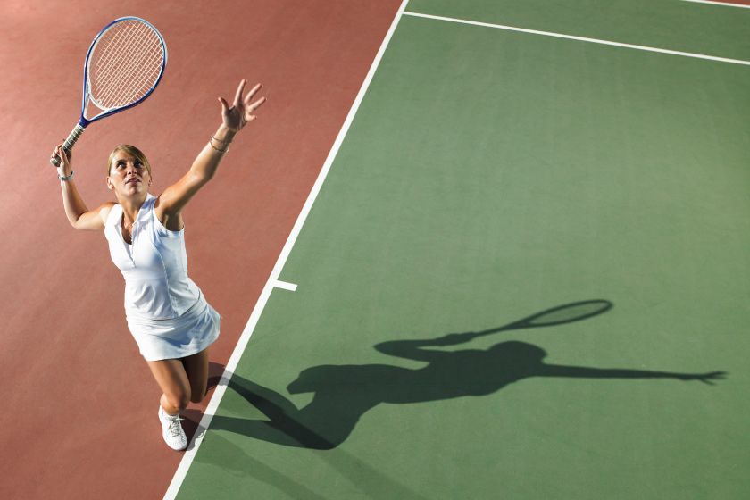 A female tennis player in action on the court