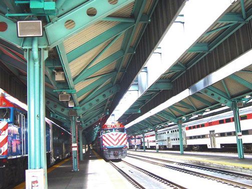 Train station with teal steel beams and platform view