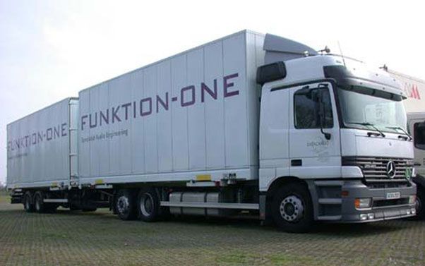Funktion-One branded white transport truck parked at an audio logistics site.