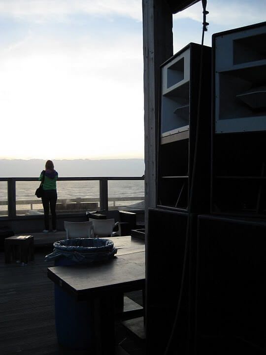 Oceanfront terrace with large sound system at sunset