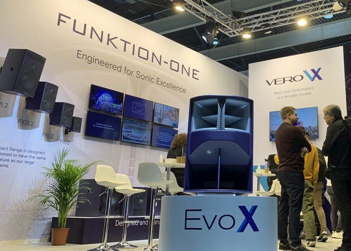 Funktion-One EvoX speaker showcased at audio expo with branding and visitors.