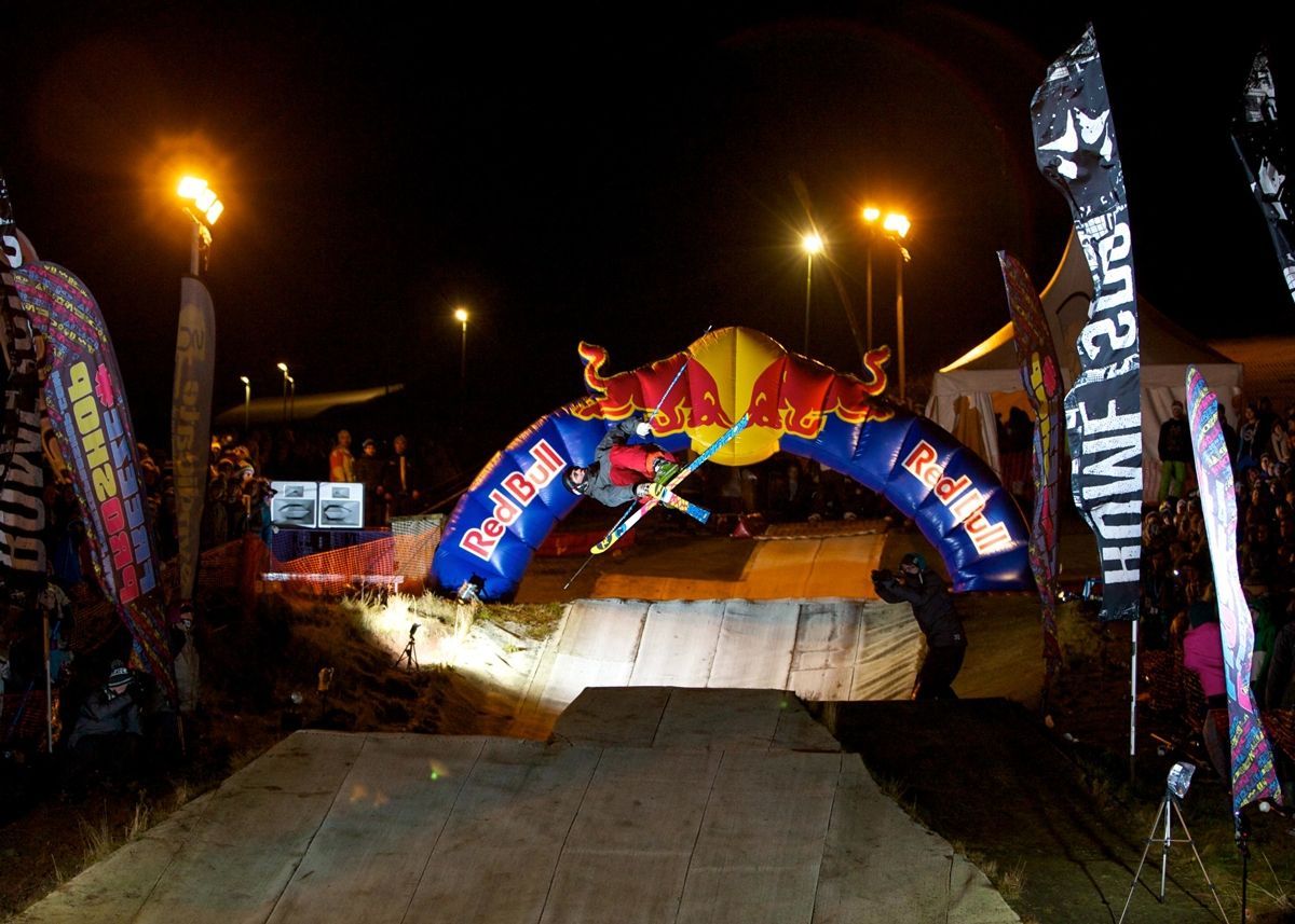 Funktion-One EvoX loudspeaker on display at audio trade show booth with branding and attendees.