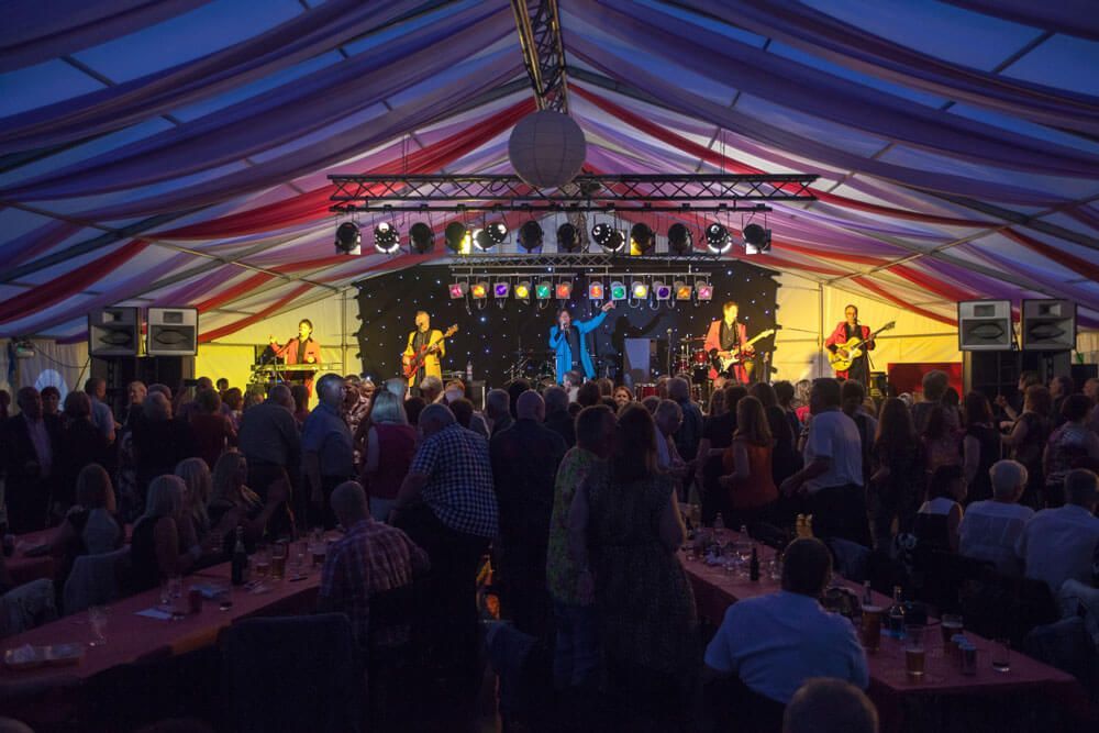 Live Music Band Performance Inside a Festival Tent