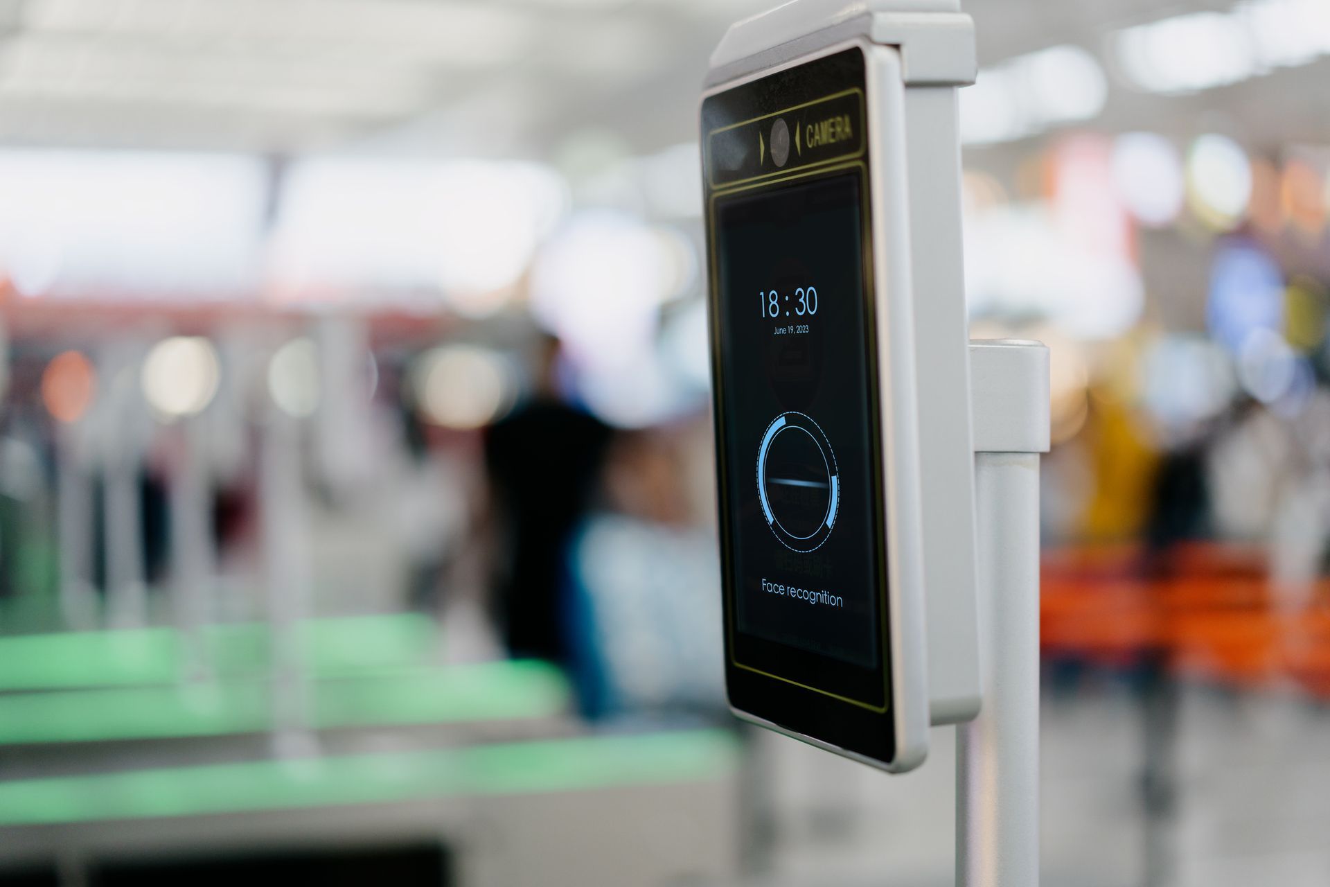 A close up of a face recognition device at an airport.