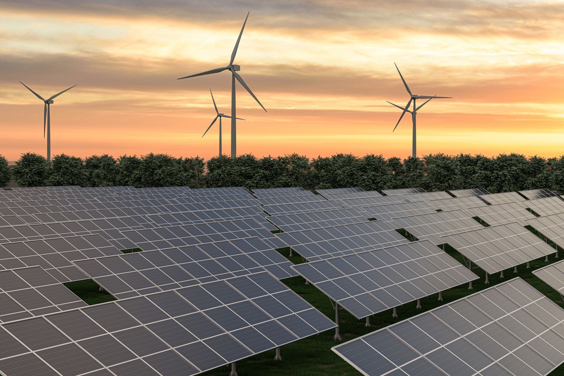 A field of solar panels and wind turbines at sunset.