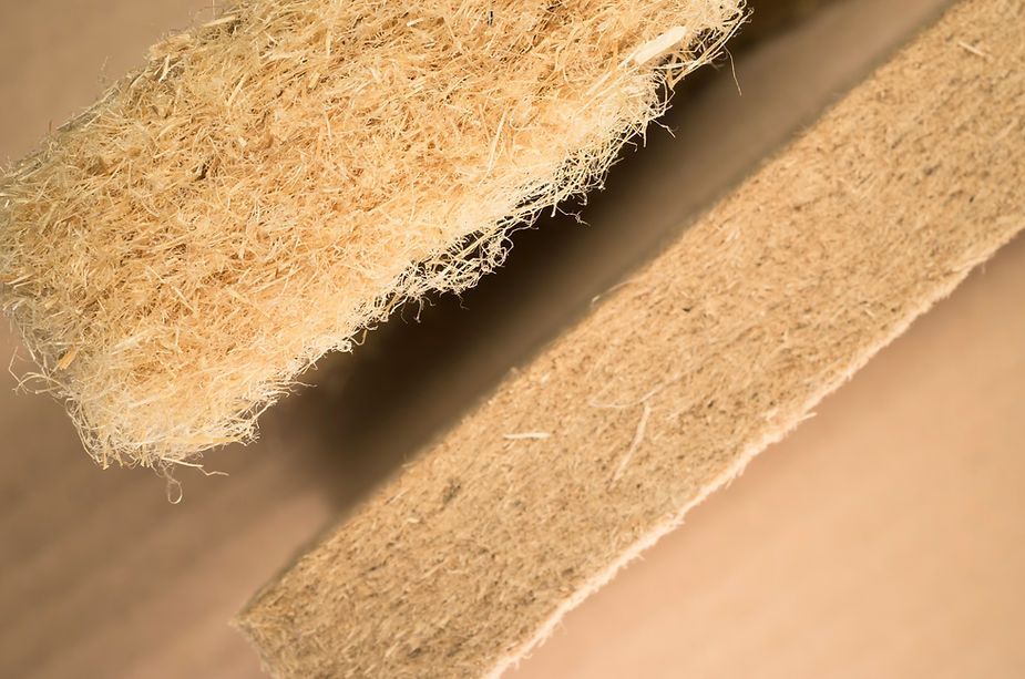 A close up of two pieces of wood on a table.