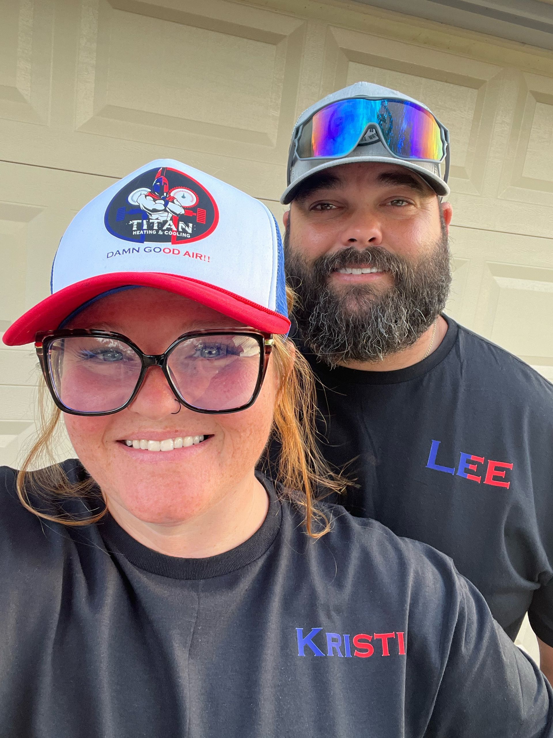 Man poses with a Titan Heating & Cooling service truck; colorful paint job, phone number, offers military discount.