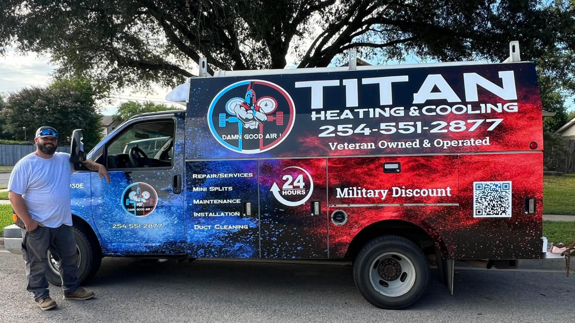 Man poses with a Titan Heating & Cooling service truck; colorful paint job, phone number, offers military discount.