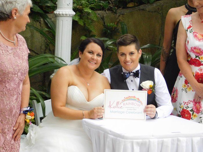 newly wed holding certificate