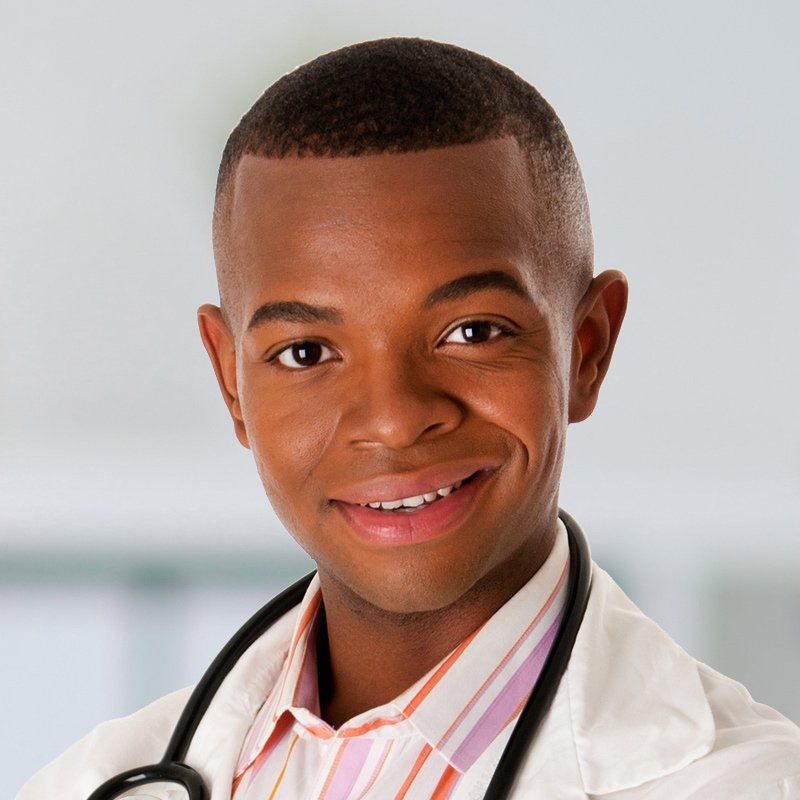 A smiling doctor with a stethoscope around his neck