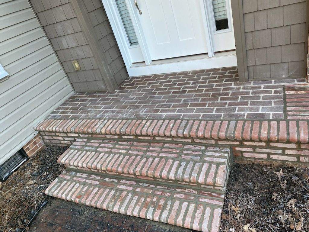 Aerial view of a winding river flowing through a dense, green forest.