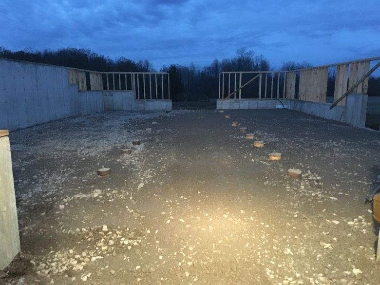 A building under construction with a blue sky in the background
