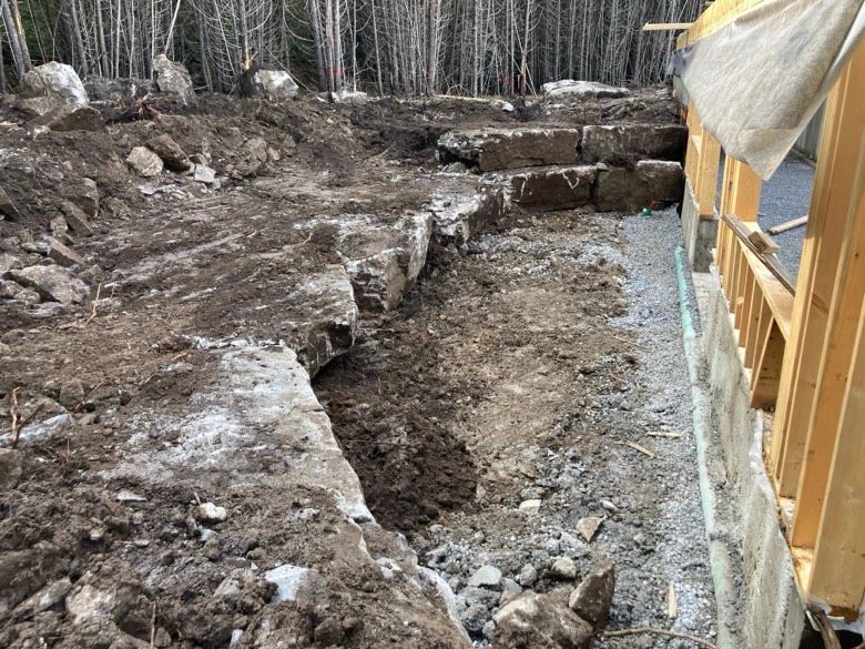 A construction site with a lot of dirt and rocks.