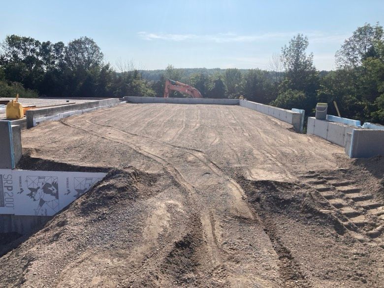 A construction site with a sign that says ' safety first ' on it