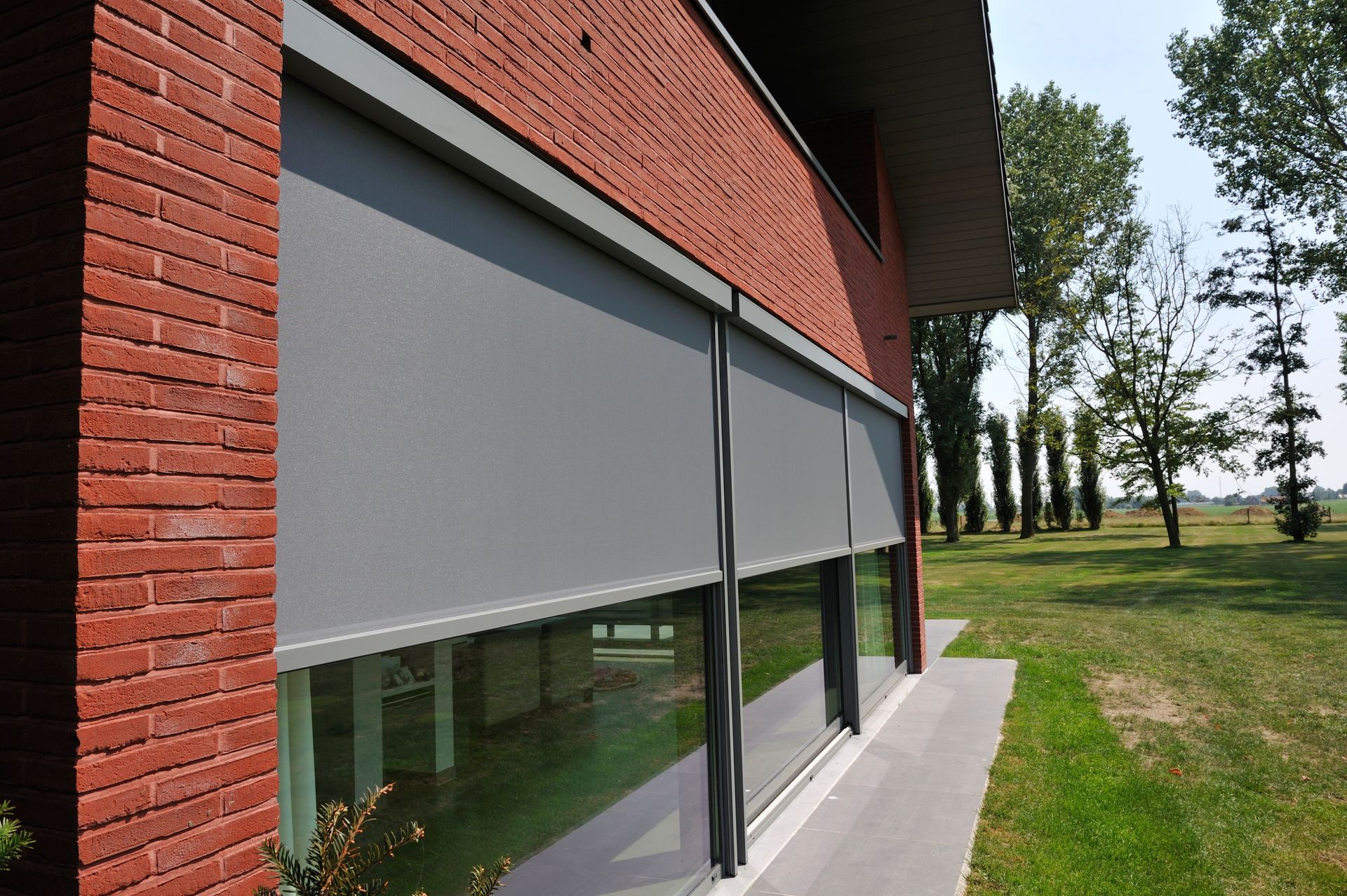 A living room with a couch , chairs , and a table.