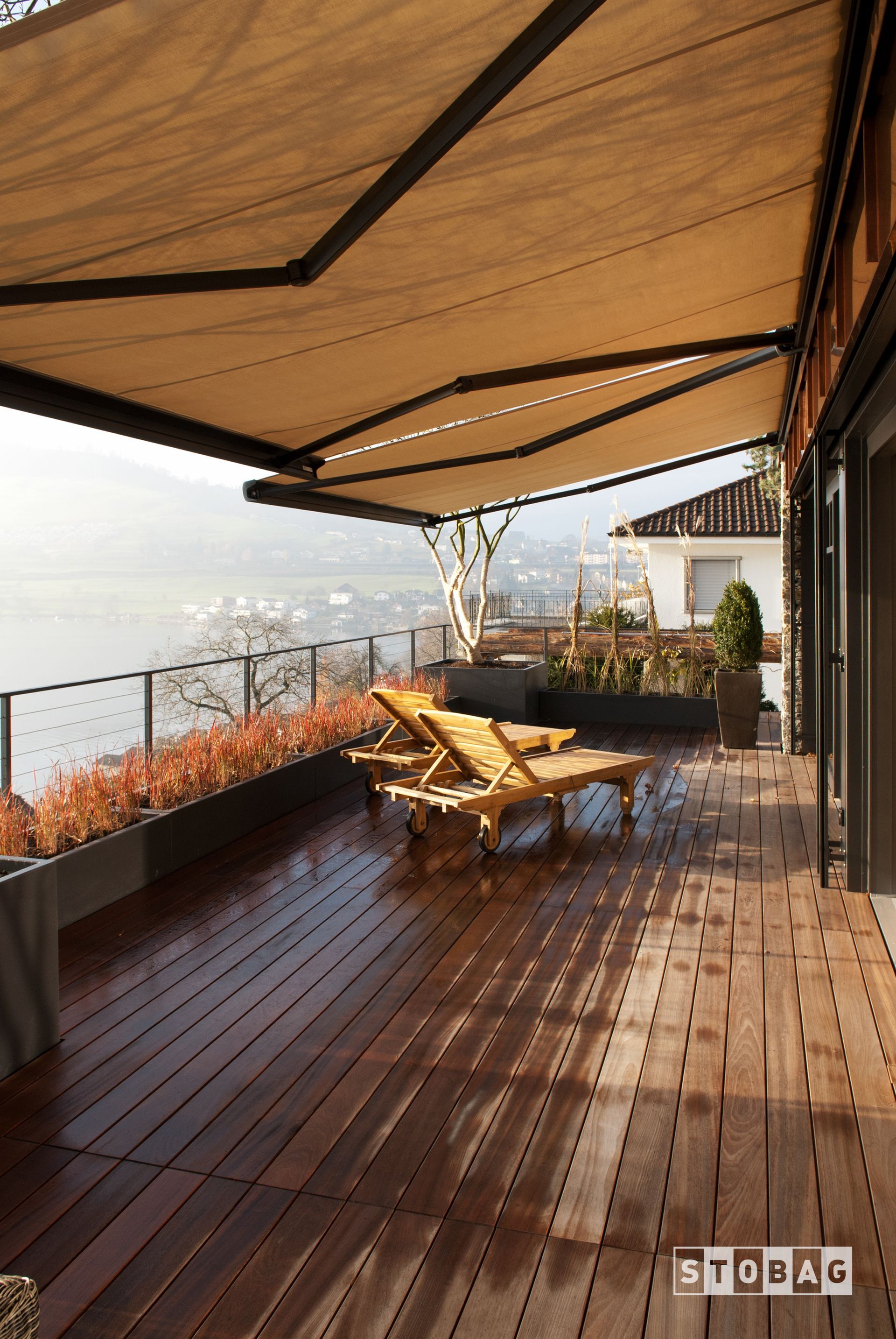 A living room with a couch , chairs , and a table.