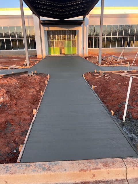 A table and chairs are sitting on a stone patio.