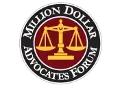A circular logo with a maroon center featuring a gold scale of justice