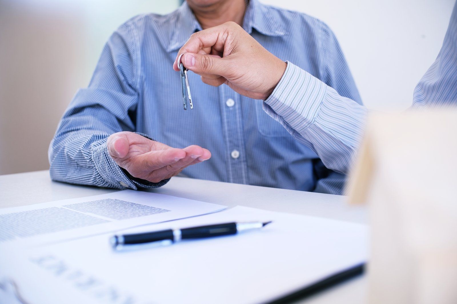 office worker holding a key