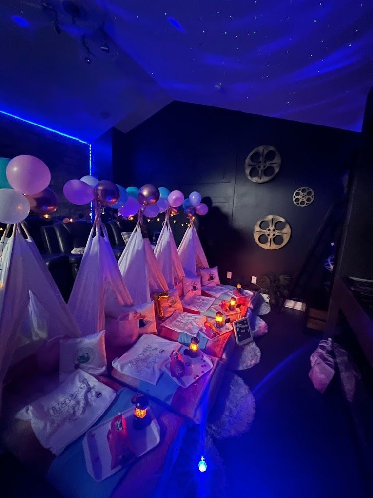 A group of tents are sitting on top of a table in a dark room.