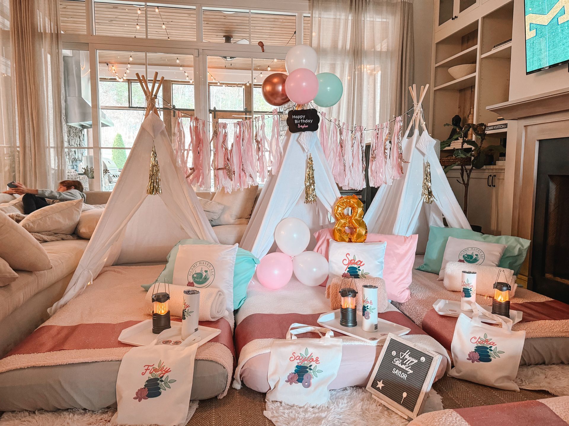 A group of teepees are sitting on the floor in a living room.