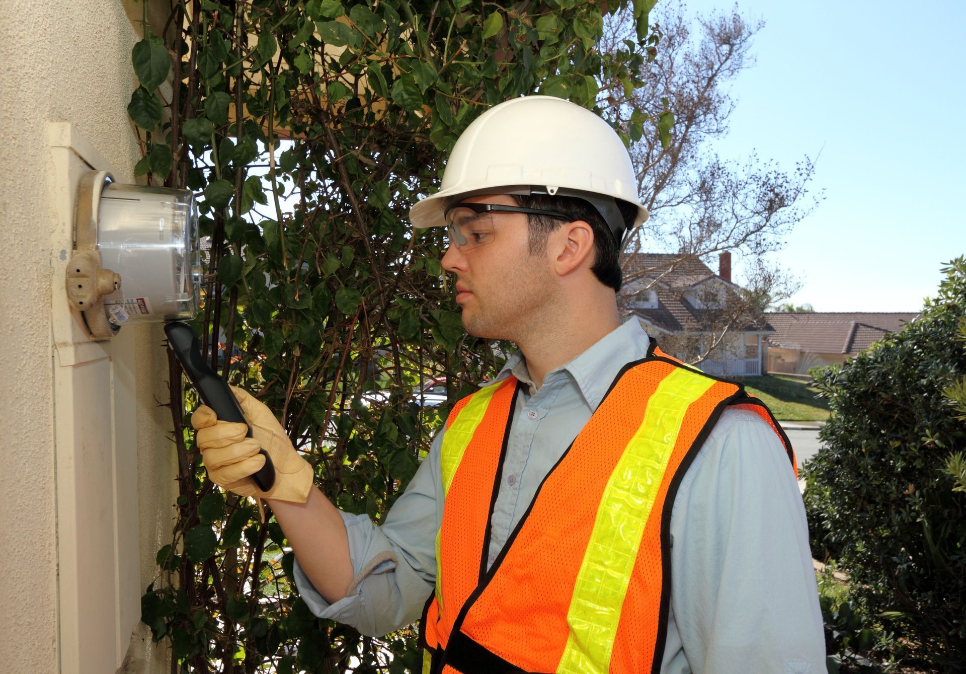 An electrician inspects a breaker panel to ensure safety in residential electrical systems. An electrician inspects a breaker panel to ensure safety in residential electrical systems.