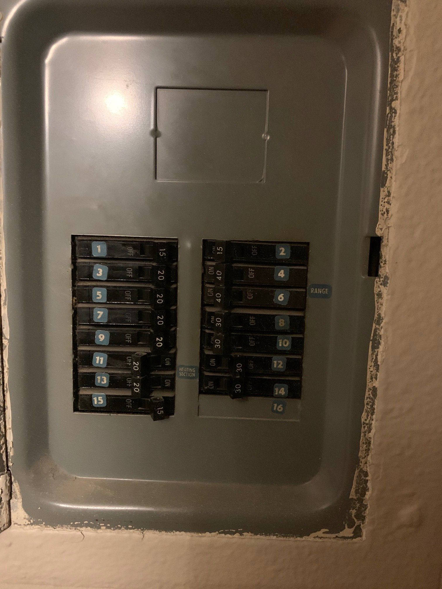 A close up of a electrical panel on a wall.