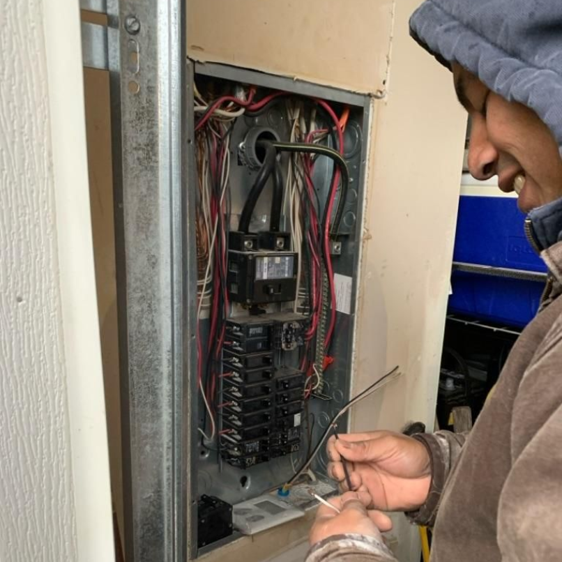 Electric Contractor repairing a unit