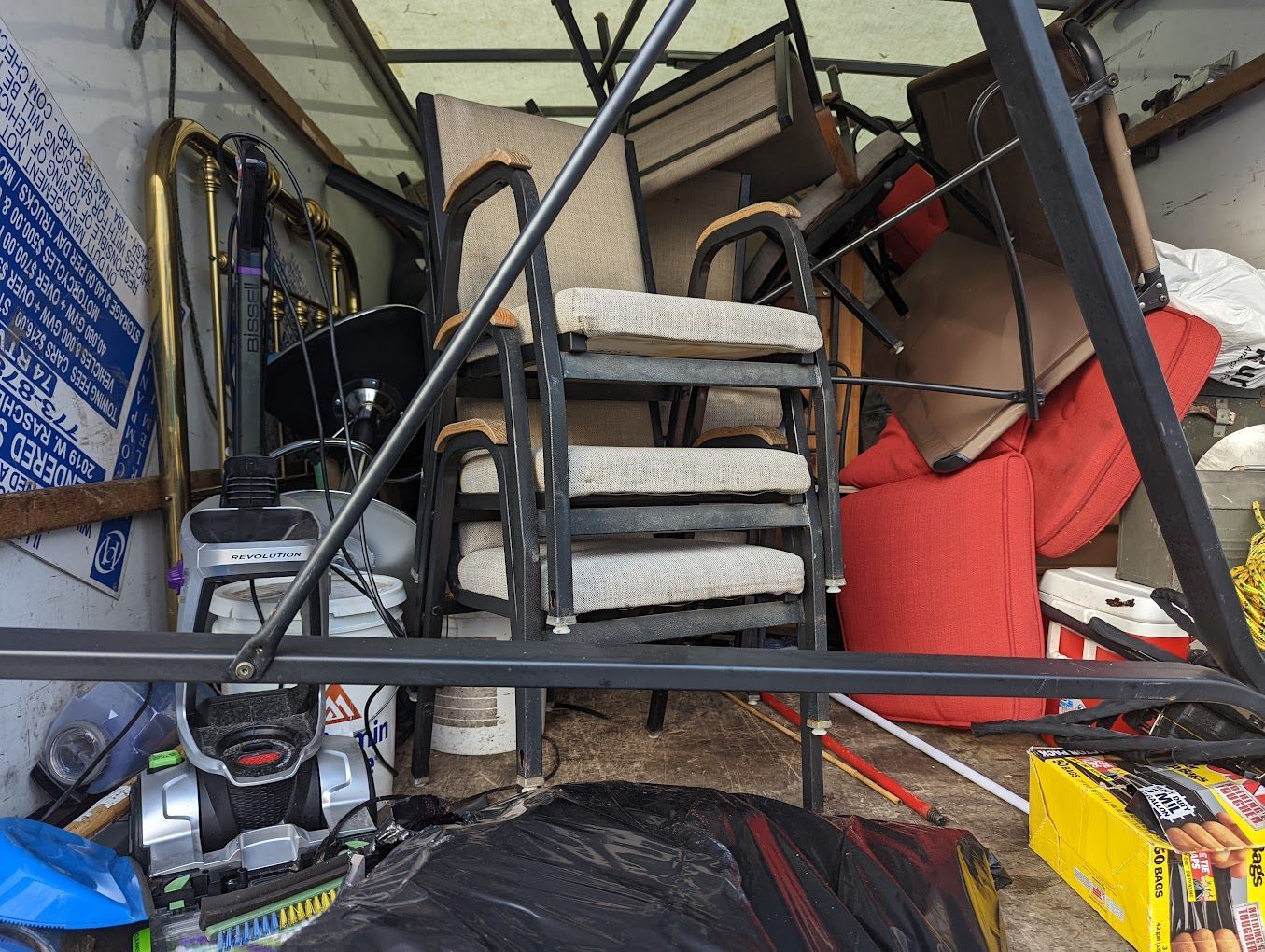 A truck filled with lots of furniture and appliances.