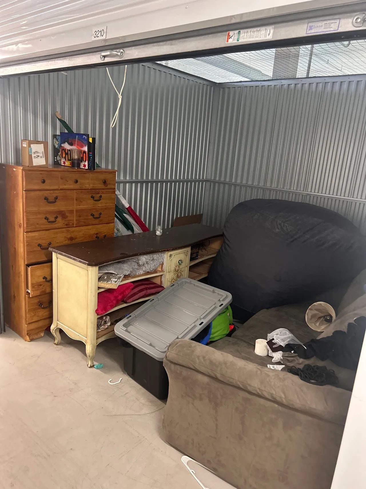 A living room filled with furniture and a dresser.