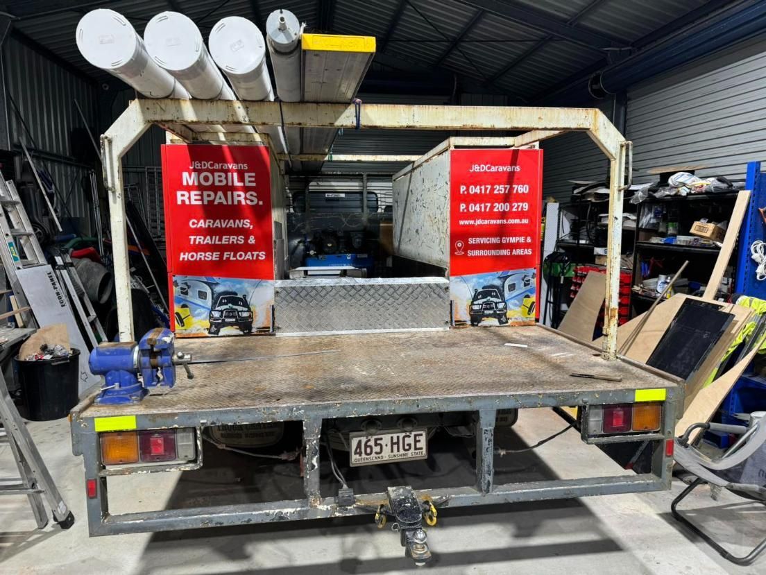 A Mobile Repair Truck is Parked in a Garage — J & D Caravans In Tamaree, QLD
