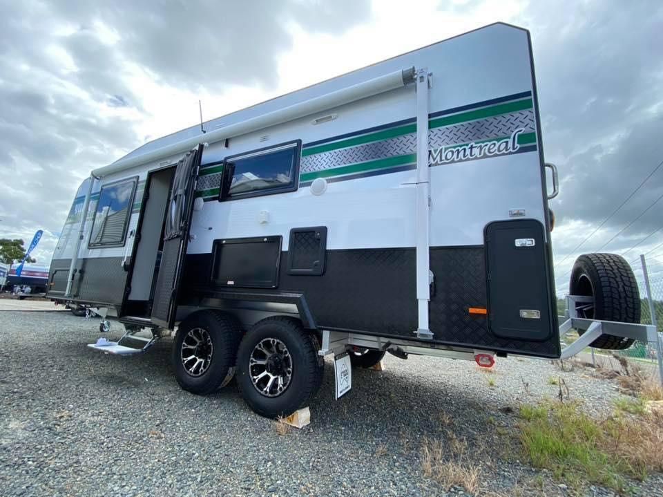 A White and Black Trailer is Parked on a Gravel Road — J & D Caravans In Cooloola, QLD