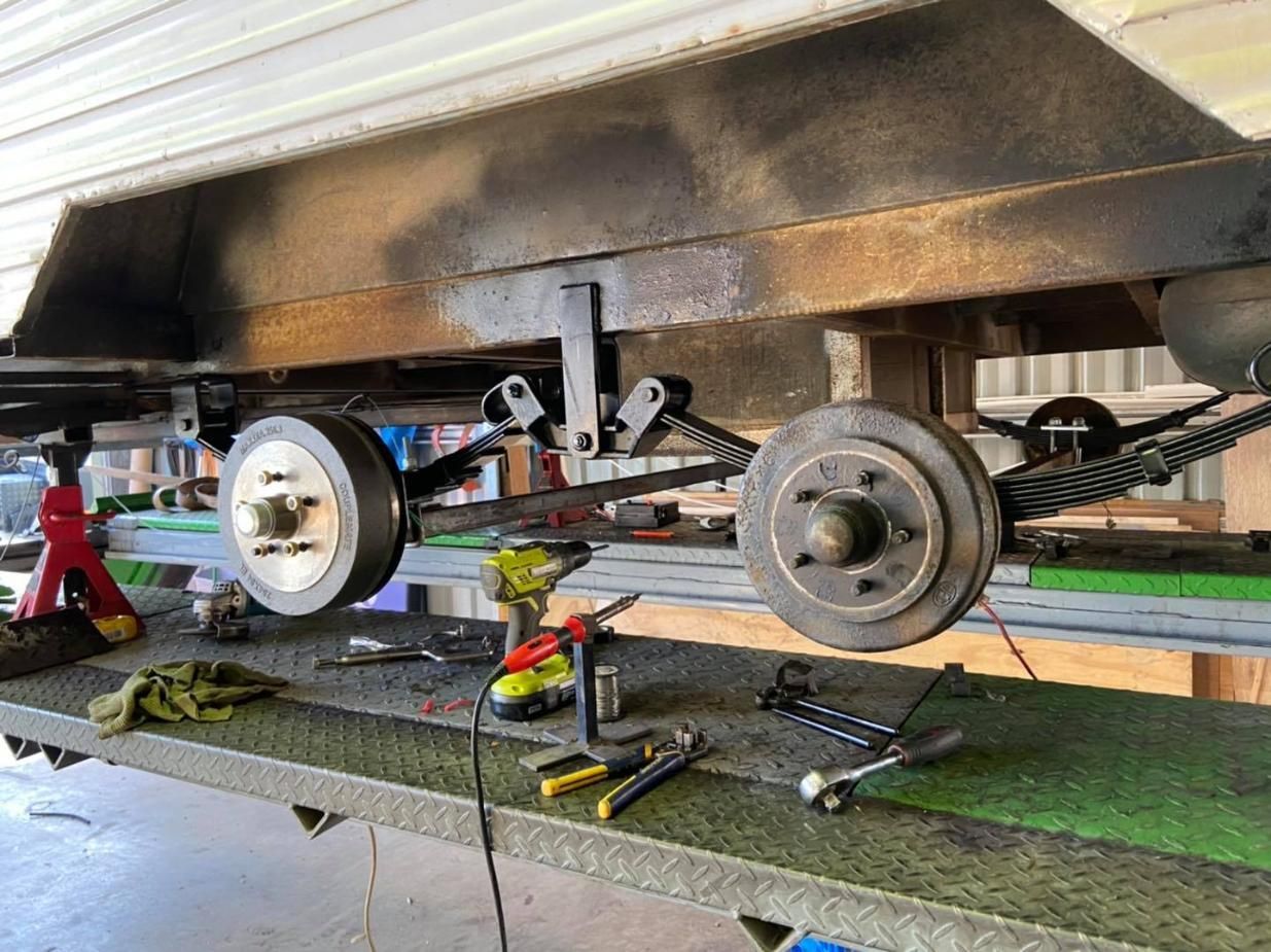 A Trailer is Being Worked on in a Garage — J & D Caravans In Tamaree, QLD