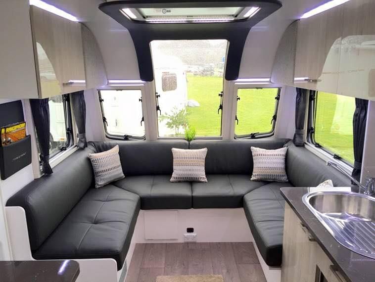 The Inside of a Camper With a Couch and a Sink — J & D Caravans In Cooroy, QLD