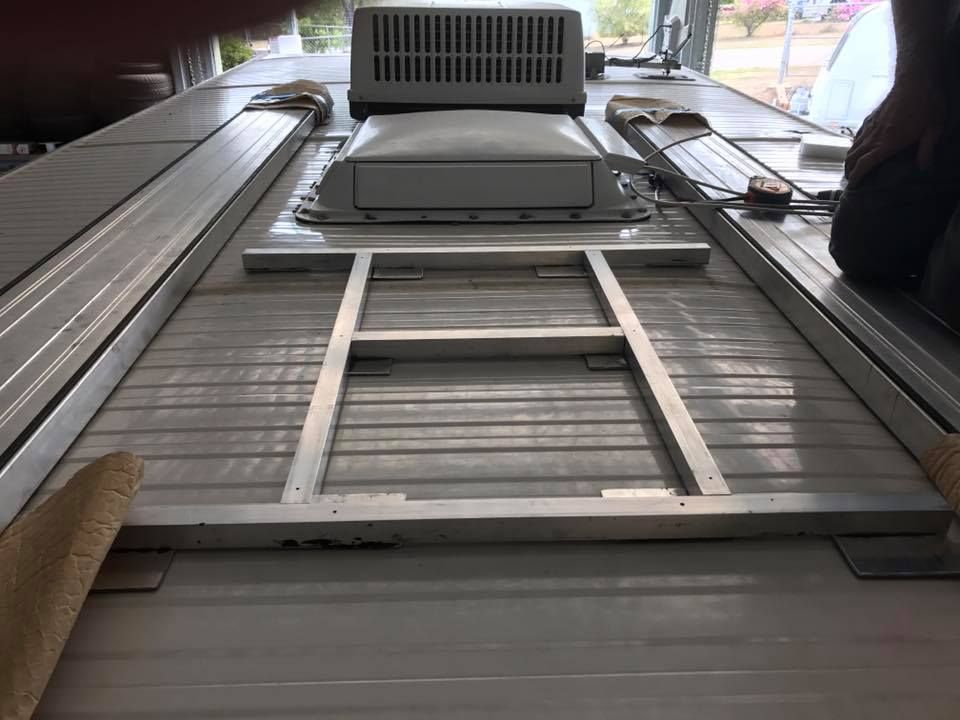 The Bottom of a Boat With a Ladder and a Fan on Top of It — J & D Caravans In Tin Can Bay, QLD