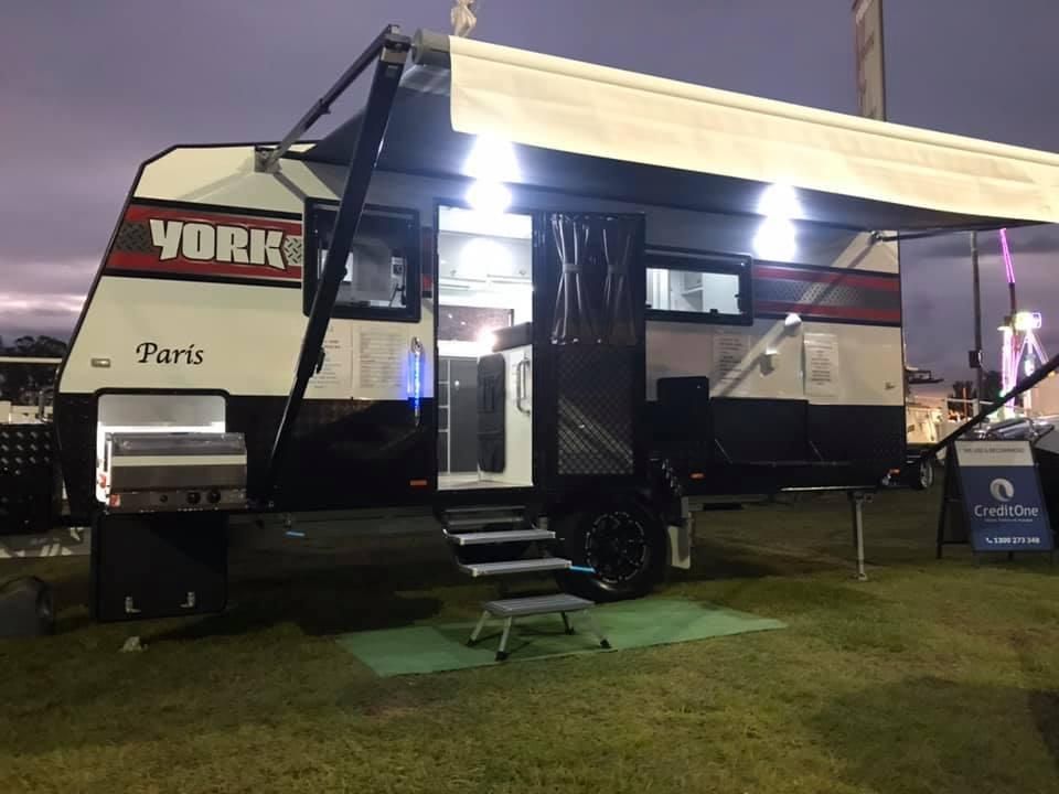 A York Paris Trailer is Parked in a Grassy Field at Night — J & D Caravans In Cooloola, QLD