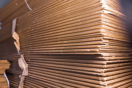 Stack of corrugated cardboard sheets.